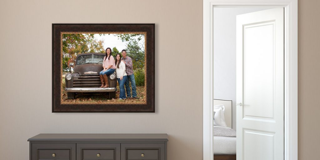 Framed family portrait hanging in a modern home.