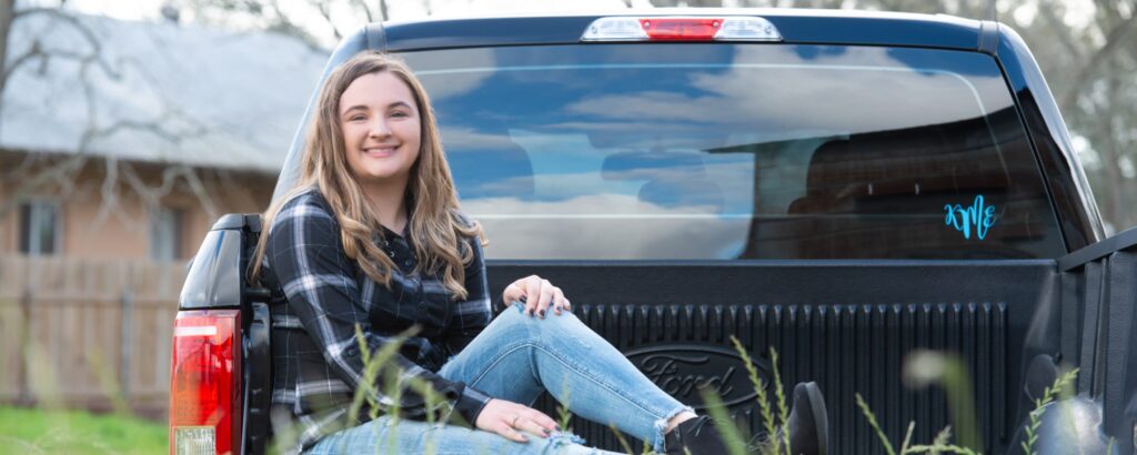 Senior pictures on the farm - girl in her pickup truck by Sandy Flint