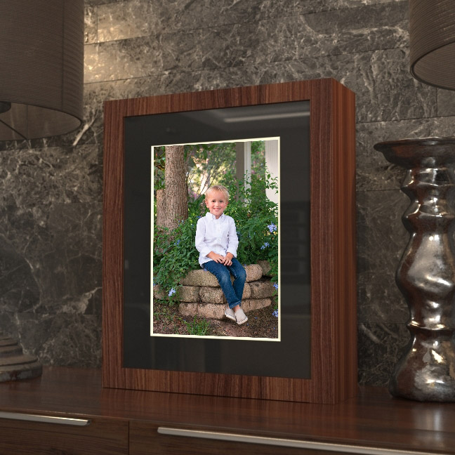 Hand-crafted walnut image box containing a collection of matted, fine-art children's portraits.